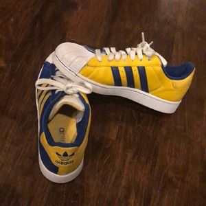 adidas blue and yellow superstar shoes